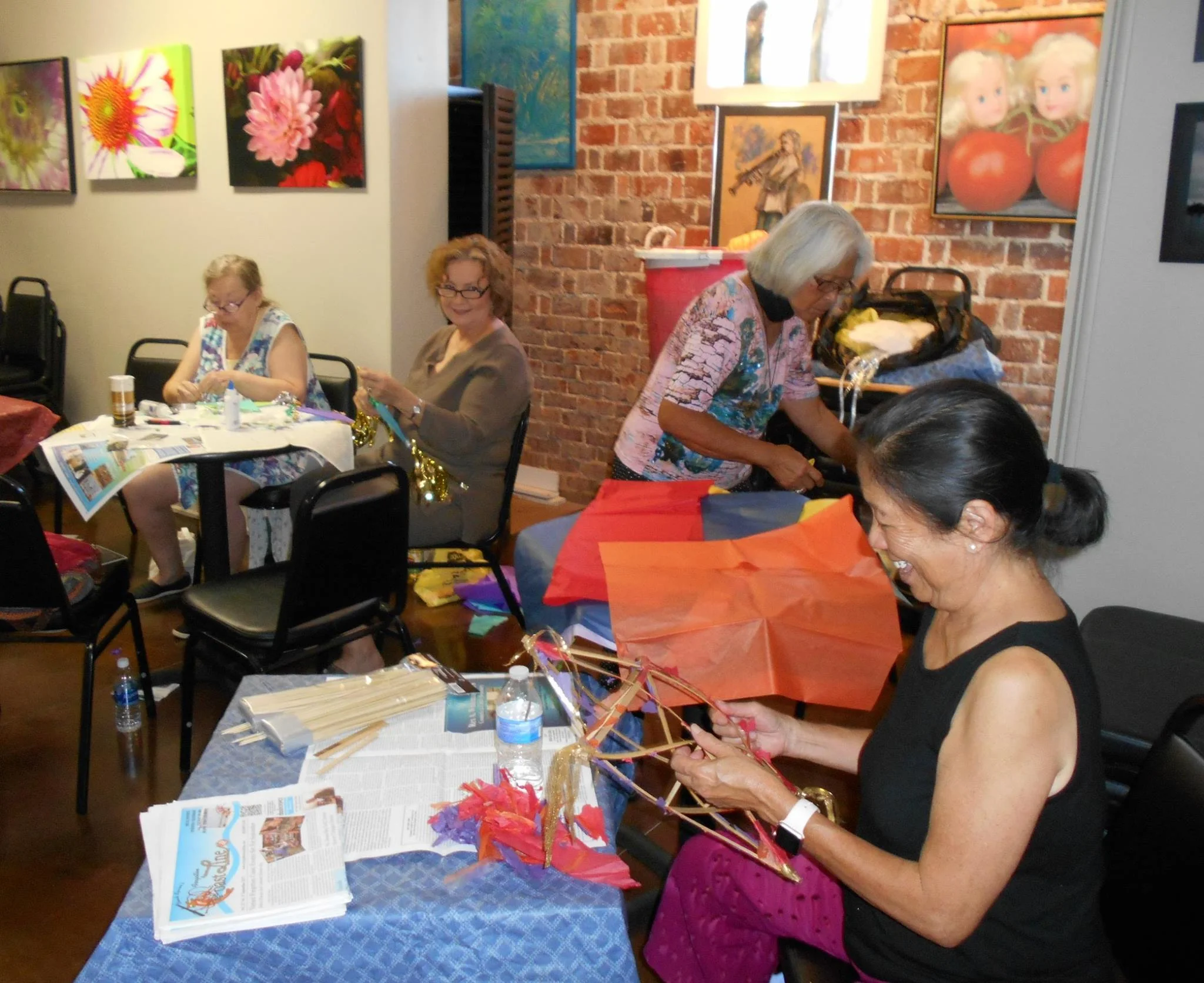 People making paper star lanterns