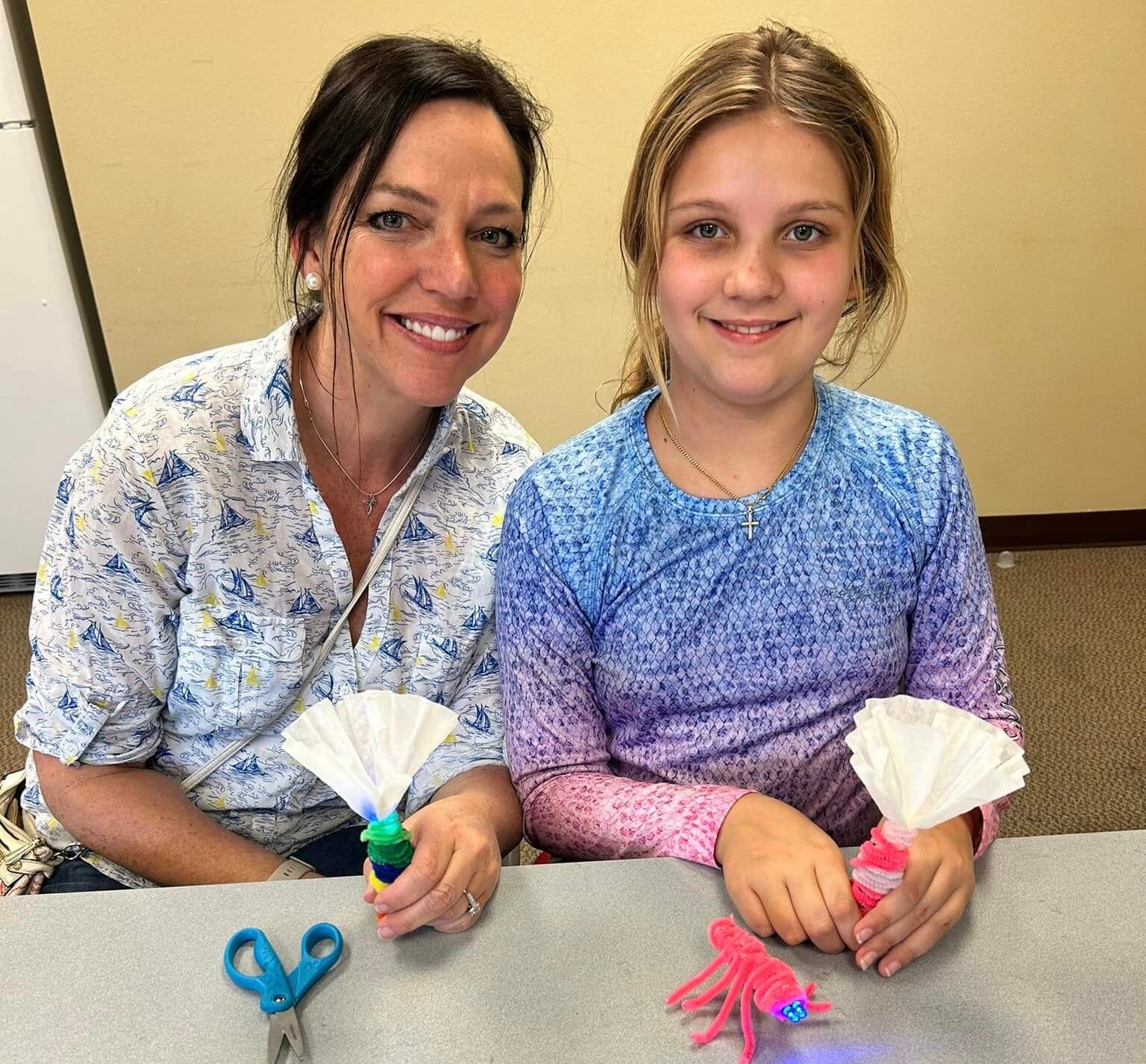 Adult and girl with crafts