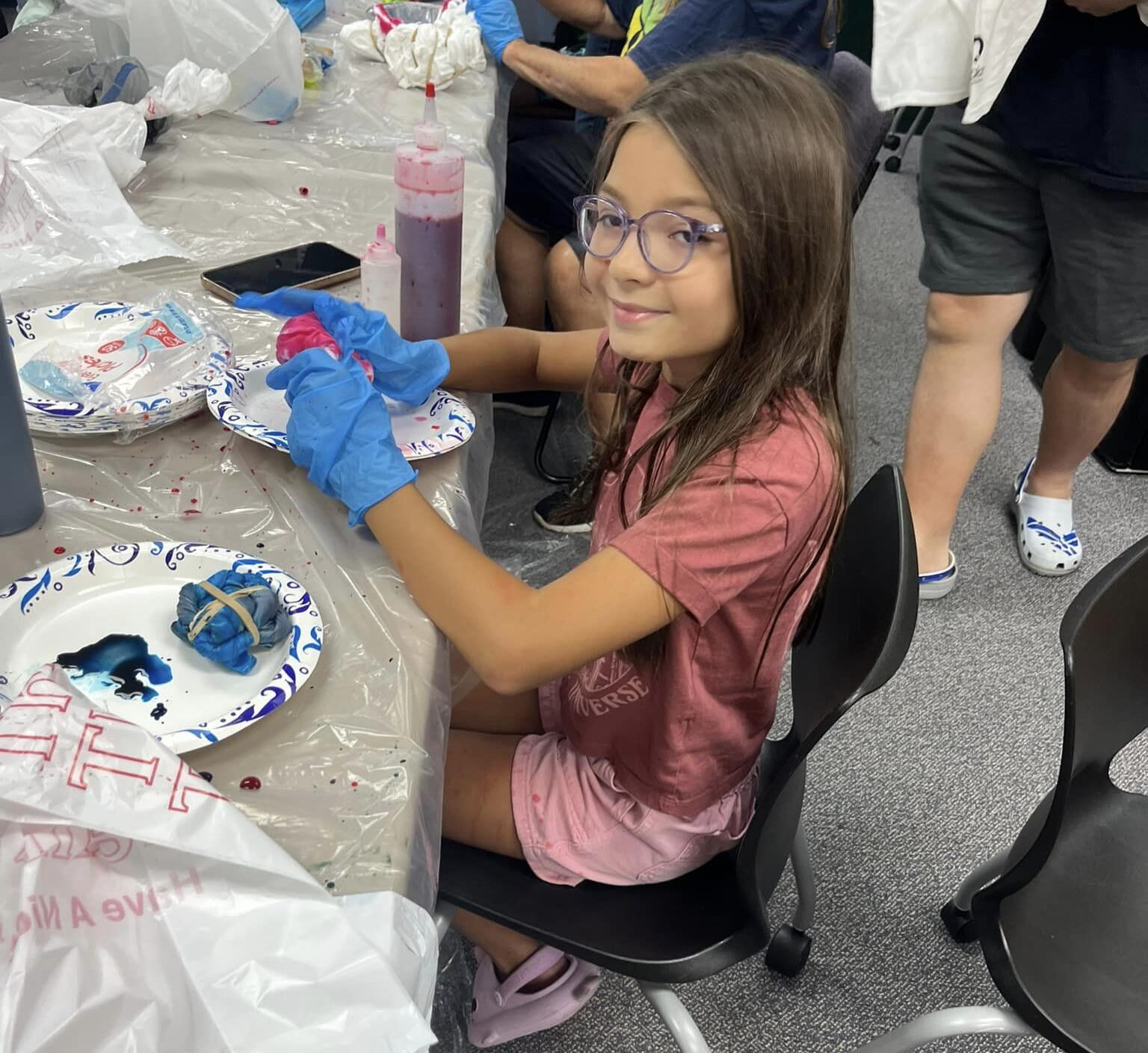 Girl doing crafts at library